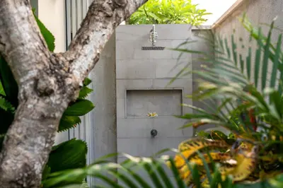 a door in the side of a building with plants at Villa Eleni - Your Private Oasis in Seminyak - A Hosted Luxury Boutique Villa in Seminyak