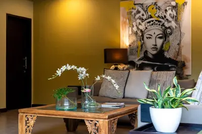 a living room with a couch and a table with plants at Villa Eleni - Your Private Oasis in Seminyak - A Hosted Luxury Boutique Villa in Seminyak