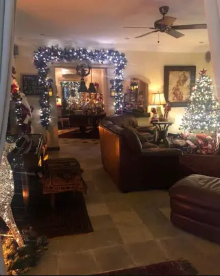 a living room with a christmas tree and christmas lights at Villa Gadja Bali in Jimbaran