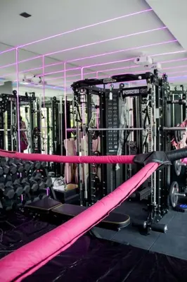 a gym with a pink ribbon and lots of machines at Luxury Villa Gym Pool and Gazebo in Canggu