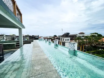 a swimming pool on the roof of a building at Hotel ARA Legian in Legian