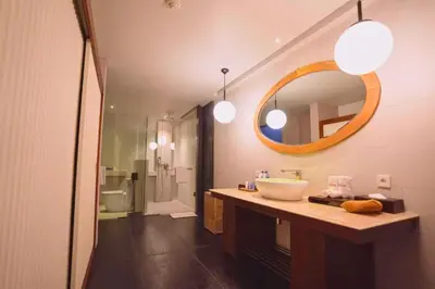 a bathroom with a sink and a mirror at Jivala 1 BR Private Pool Villa in Seminyak