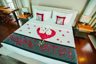 a bedroom with a bed with red hearts on it at Jivala 1 BR Private Pool Villa in Seminyak