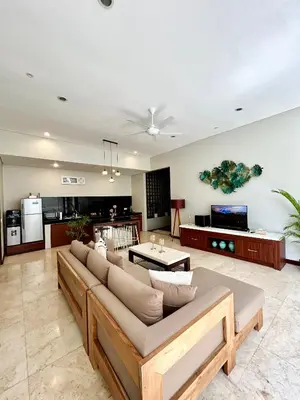 a living room with a couch and a table at MJ Orchid Residence in Seminyak