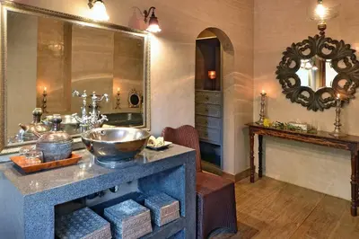 a bathroom with a counter with a sink and a mirror at Moments Villa in Jimbaran