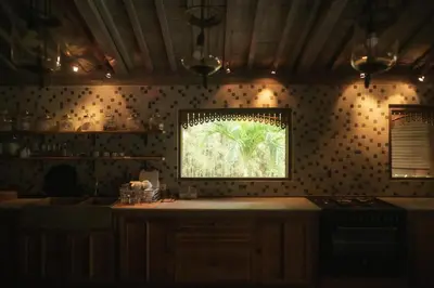a kitchen with a counter and a window on the wall at Moments Villa in Jimbaran
