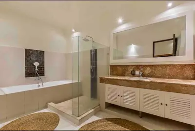a bathroom with a shower and a sink and a tub at Spacious 2bdr Seminyak walking eat&shop street in Seminyak