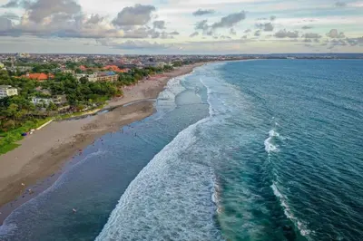 an aerial view of a beach and the ocean at Nakula Stay Kuta in Kuta