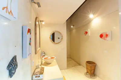 a bathroom with a sink and a mirror at Villa Chantal-Intimate Villa in Seminyak in Seminyak