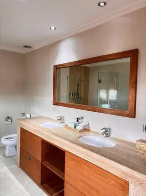a bathroom with two sinks and a mirror at 4 Bedroom Tropical Luxury Villa in Seminyak