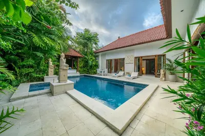 a swimming pool in the backyard of a villa at Villa Nemia Seminyak in Seminyak
