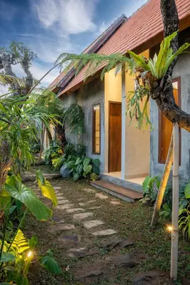 a house with a pathway in front of it at Green Loft Citarum in Sanur