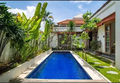 a swimming pool in the backyard of a house at Villa Catta Seminyak in Legian