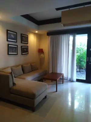 a living room with a couch and a table at Seminyak Apartment by LBV in Seminyak