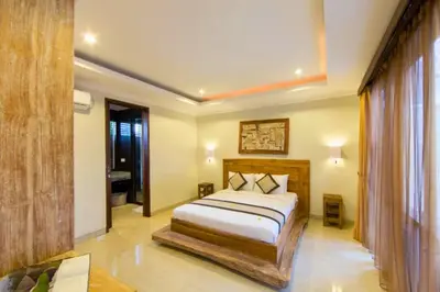 a bedroom with a bed in a room at Divija 2 BR Private Pool Villa in Seminyak