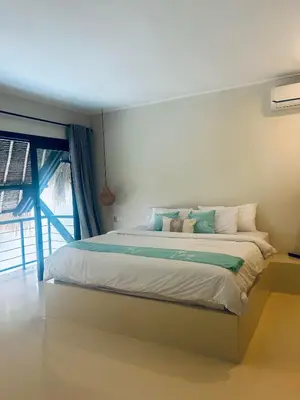 a bedroom with a large bed with a window at Villa Malicott Athena - 3C in Seminyak