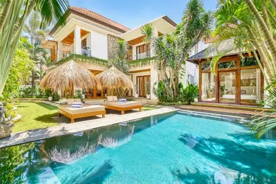an exterior view of a villa with a swimming pool at Villa Chicago Brand new 7 BDR private pool in Seminyak