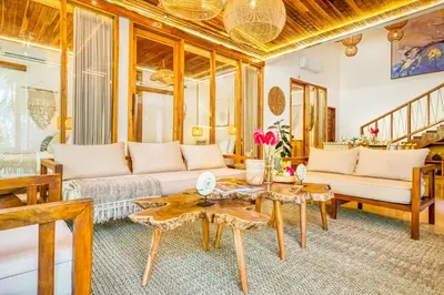 a living room with a couch and a table at Villa Chicago Brand new 7 BDR private pool in Seminyak