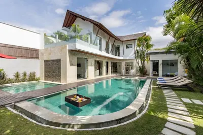 an exterior view of a house with a swimming pool at Spacious 4BR Villa with Pool in Central Seminyak in Seminyak