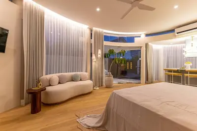 a large bedroom with a bed and a kitchen at Uniquely designed 1bd villa with Pvt Pool in Umalas