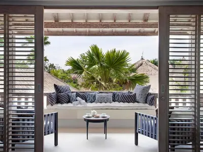 a living room with a couch and a table at Villa Adasa by Elite Havens in Seminyak