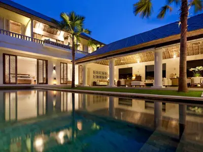 a house with a swimming pool in front of it at Villa Adasa by Elite Havens in Seminyak