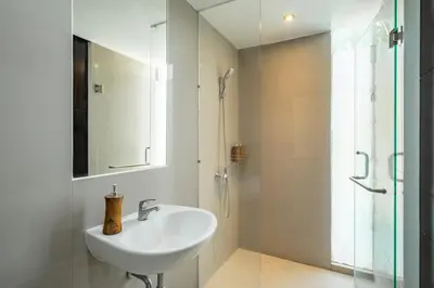 a bathroom with a sink and a shower at Villa De Luca By Aishwarya International in Umalas
