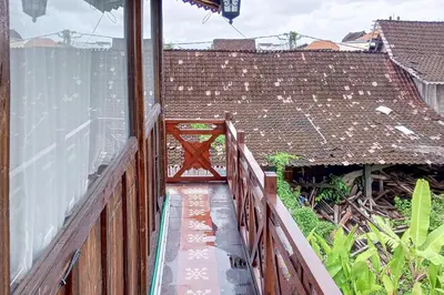 a view of a balcony with a wooden fence at Wakajima House Kerobokan by The Lavana in Kerobokan