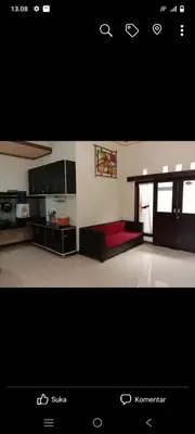 a large living room with a red couch in it at Nyoman bali house villa in Seminyak