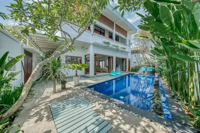 an exterior view of a villa with a swimming pool at Villa Ima in Canggu