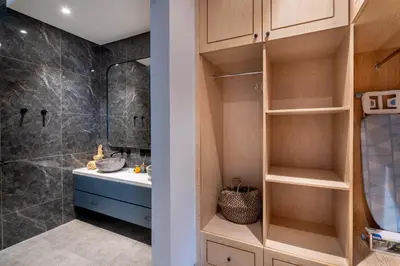 a bathroom with a sink and a shower at Villa Indah in Legian