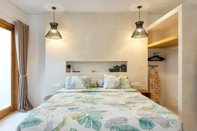a bedroom with a large bed with a colorful comforter at Spacious 1Br Villas in Seminyak in Seminyak