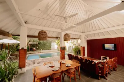 a dining room with a table and chairs and a pool at Amazing 2 Bedroom Villa 5 Min To The Beach - Durna Villa in Canggu