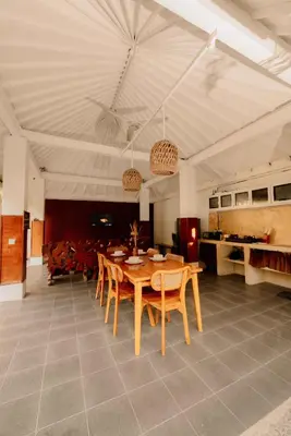 a dining room with a wooden table and chairs at Amazing 2 Bedroom Villa 5 Min To The Beach - Durna Villa in Canggu