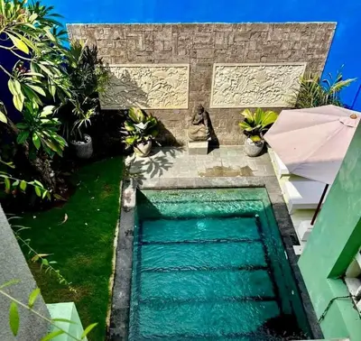 a swimming pool in the backyard of a villa at Villa Shantia by Bby Diamond in Legian