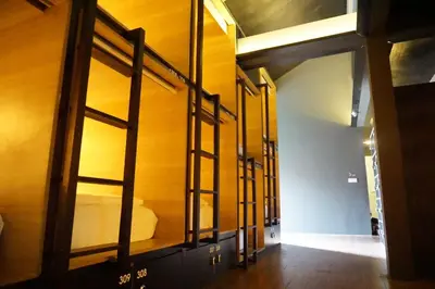 a group of bunk beds in a room at M Boutique Hostel in Seminyak