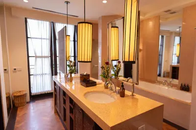 a bathroom with a sink and a large mirror at 1BR Suite Ocean View in Seminyak