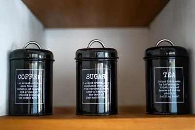three black containers sitting on top of a table at Villa Rhapsody Seminyak in Seminyak