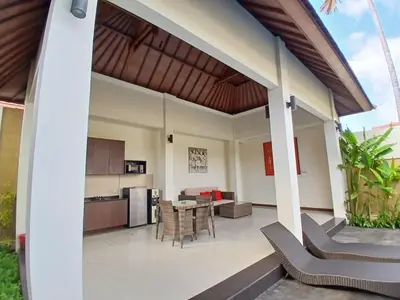 an open kitchen and dining area of a house at Villa Putri in Seminyak Bali in Seminyak