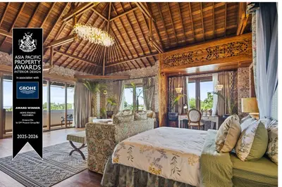 a bedroom with a large bed and a chandelier at Luxurious Arakana Villa with Pool in Jimbaran