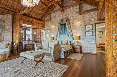 a living room with a bed and a couch at Luxurious Arakana Villa with Pool in Jimbaran