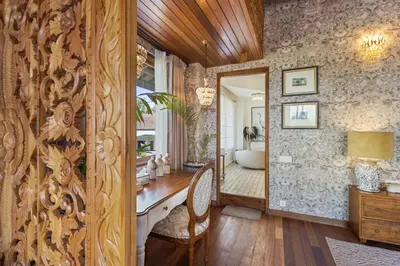 a bathroom with a mirror and a sink and a tub at Luxurious Arakana Villa with Pool in Jimbaran