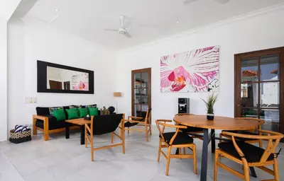 a living room with a table and chairs and a couch at Gorgeous 2 Bed Pool Villa, Walk to Seminyak Beach in Seminyak