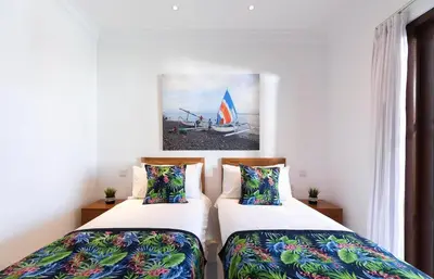 two beds sitting next to each other in a room at Gorgeous 2 Bed Pool Villa, Walk to Seminyak Beach in Seminyak
