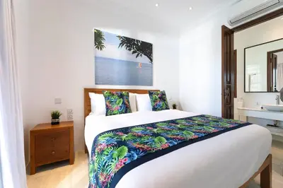 a bedroom with a large bed and a sink at Gorgeous 2 Bed Pool Villa, Walk to Seminyak Beach in Seminyak
