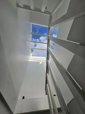 a white room with a window with the sky at Nikaya Villa - 3 Bedrooms Near Seminyak in Legian