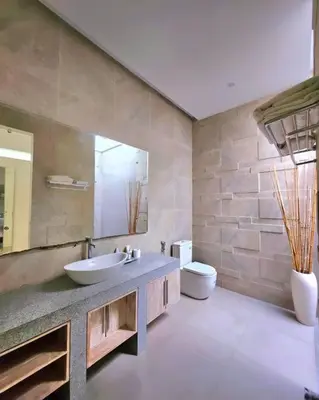 a bathroom with a sink and a toilet at Nikaya Villa - 3 Bedrooms Near Seminyak in Legian