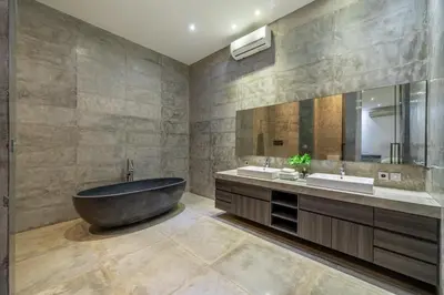 a bathroom with a large tub and two sinks at Villa Simpatico Spacious 6 BR Villa Retreat in Central Seminyak in Seminyak