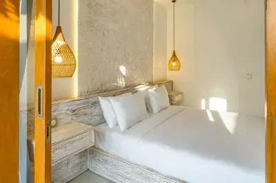 a bedroom with a white bed with white pillows at T&J3 - New! Romantic 1BR pool villa in Umalas
