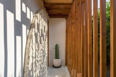 a hallway with a cactus sitting next to a wall at T&J3 - New! Romantic 1BR pool villa in Umalas